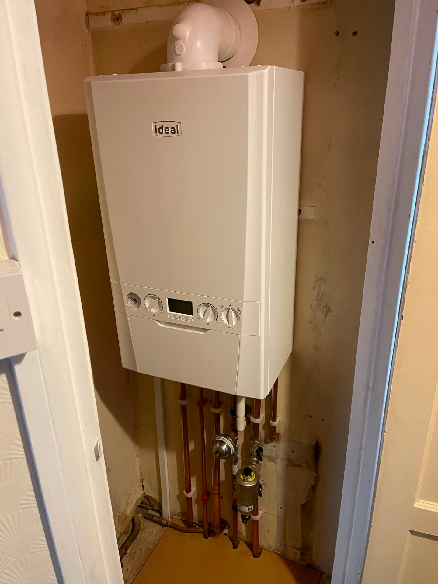 Ideal boiler installation in an airing cupboard with magnetic system filter fitted, fitted by Gas Safe registered engineers in Essex